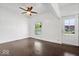 Bedroom featuring dark hardwood floors, and a large window providing natural light at 301 S Main St, Whitestown, IN 46075