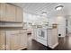 Functional kitchen with white appliances and cabinetry, offering a cozy space for cooking and meal preparation at 301 S Main St, Whitestown, IN 46075