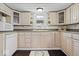 Well-lit kitchen featuring ample cabinet space, modern appliances, and a view of the outdoor greenery at 301 S Main St, Whitestown, IN 46075