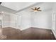 Living room featuring dark hardwood floors, and white walls, creating a bright open space at 301 S Main St, Whitestown, IN 46075