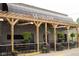Outdoor dining area with pergola and hanging plants creates a welcoming ambiance at the cafe at 301 S Main St, Whitestown, IN 46075
