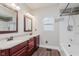 Modern bathroom featuring dual sinks, tiled floors, and updated fixtures, creating a spa-like retreat at 3035 N Capitol Ave, Indianapolis, IN 46208