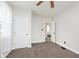 This bedroom features neutral walls, gray carpet and an open doorway that leads into the home at 3035 N Capitol Ave, Indianapolis, IN 46208