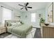 Stylishly decorated bedroom with modern ceiling fan, large windows, and minimalist decor at 3035 N Capitol Ave, Indianapolis, IN 46208