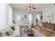 Bright living room featuring hardwood floors, modern furniture, and large windows at 3035 N Capitol Ave, Indianapolis, IN 46208
