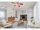 Inviting living room with a decorative fireplace, modern furnishings, and hardwood floors at 3035 N Capitol Ave, Indianapolis, IN 46208