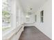Bright sunroom with white shiplap and many windows at 3035 N Capitol Ave, Indianapolis, IN 46208