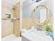 Bathroom with tiled shower, mosaic details, modern vanity, and decorative mirror at 3223 Keystone Lakes Way, Indianapolis, IN 46237