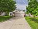 Charming home featuring a two-car garage, long driveway, landscaped front yard, and a lovely mix of siding and brick at 3223 Keystone Lakes Way, Indianapolis, IN 46237