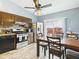 Kitchen with granite countertops, stainless steel appliances, dark wood cabinets, and an eat-in dining area at 3223 Keystone Lakes Way, Indianapolis, IN 46237