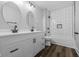 Bathroom with double vanity, modern faucets, and tiled shower at 3227 Guilford Ave, Indianapolis, IN 46205