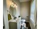 Bright bathroom with updated vanity, fixtures, lighting, and a window for natural light at 3227 Guilford Ave, Indianapolis, IN 46205