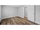 Bedroom features wood-look flooring, neutral walls and trim, and a closet at 3227 Guilford Ave, Indianapolis, IN 46205