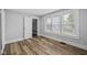 Bright bedroom with ample natural light, closet space, and hardwood floors at 3227 Guilford Ave, Indianapolis, IN 46205