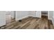 Bedroom shows wood-look flooring, neutral walls and trim, and multiple closets at 3227 Guilford Ave, Indianapolis, IN 46205