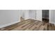 Bedroom features wood-look flooring, neutral walls and trim, and an open closet at 3227 Guilford Ave, Indianapolis, IN 46205
