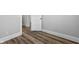 Bedroom shows wood-look flooring, neutral walls and trim, and a closet at 3227 Guilford Ave, Indianapolis, IN 46205