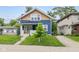 Charming two-story home with a welcoming porch and well-manicured lawn, creating a cozy curb appeal at 3227 Guilford Ave, Indianapolis, IN 46205