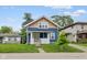 Charming two-story home with a welcoming porch and well-manicured lawn, creating a cozy curb appeal at 3227 Guilford Ave, Indianapolis, IN 46205
