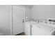 Functional laundry room equipped with a washer, dryer, and convenient access to the outdoors at 3227 Guilford Ave, Indianapolis, IN 46205