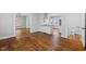 Living area open to kitchen with hardwood floors and ample light at 3227 Guilford Ave, Indianapolis, IN 46205