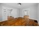 Spacious living room featuring hardwood floors and elegant trim, perfect for gathering at 3227 Guilford Ave, Indianapolis, IN 46205