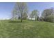 Expansive backyard with mature trees offering plenty of privacy and space at 407 N Matthews Rd, Greenwood, IN 46143