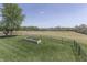 Expansive backyard with a garden bed and scenic views, enclosed by a sleek black fence at 407 N Matthews Rd, Greenwood, IN 46143