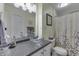 Bathroom featuring a glass vessel sink and floral shower curtain at 407 N Matthews Rd, Greenwood, IN 46143