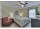 Bedroom featuring a patterned accent chair and ceiling fan at 407 N Matthews Rd, Greenwood, IN 46143