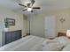Bedroom featuring a ceiling fan and neutral decor at 407 N Matthews Rd, Greenwood, IN 46143
