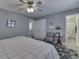 Bright bedroom with a ceiling fan, wood floors, and ensuite bathroom at 407 N Matthews Rd, Greenwood, IN 46143
