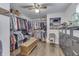 Walk-in closet with ample shelving and an ottoman in the center at 407 N Matthews Rd, Greenwood, IN 46143