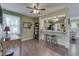 Comfortable dining area with a view into the kitchen, showcasing the open layout and breakfast bar seating at 407 N Matthews Rd, Greenwood, IN 46143
