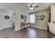 Inviting dining area featuring dark wood floors, classic décor and a seamless connection to other living spaces at 407 N Matthews Rd, Greenwood, IN 46143