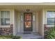 Charming front entrance with decorative door and covered porch at 407 N Matthews Rd, Greenwood, IN 46143