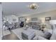 Bright living room showcasing an open layout with comfortable seating and hardwood floors throughout the room at 407 N Matthews Rd, Greenwood, IN 46143