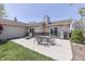 Home's patio features dining set and grill with landscaped perimeter at 407 N Matthews Rd, Greenwood, IN 46143