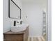 Elegant bathroom features a double sink vanity with modern faucets and contemporary mirror at 4126 S Gerrard Dr, Indianapolis, IN 46221