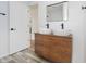 Modern bathroom boasting a double sink vanity with vessel sinks, sleek faucets, and clean white walls at 4126 S Gerrard Dr, Indianapolis, IN 46221