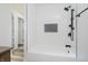 Bright bathroom showcases a white tiled shower and modern black shower fixtures at 4126 S Gerrard Dr, Indianapolis, IN 46221