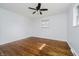 Inviting bedroom with beautiful hardwood floors, a ceiling fan, and ample natural light for a serene atmosphere at 4126 S Gerrard Dr, Indianapolis, IN 46221