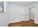Bright bedroom featuring wood-look flooring and white walls, offering a clean and modern aesthetic at 4126 S Gerrard Dr, Indianapolis, IN 46221