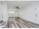 Bright, spacious room with hardwood floors, a modern ceiling fan, and ample natural light at 4126 S Gerrard Dr, Indianapolis, IN 46221