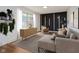 Cozy living room features hardwood floors, a stylish rug, and a comfortable sectional sofa at 4126 S Gerrard Dr, Indianapolis, IN 46221