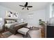 Cozy bedroom featuring a wooden bed frame, modern ceiling fan, and neutral decor for a relaxing retreat at 4126 S Gerrard Dr, Indianapolis, IN 46221