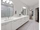 Bright bathroom featuring a double vanity with quartz countertops and modern fixtures at 435 Virginia Ave # 101, Indianapolis, IN 46203