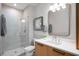 Bathroom featuring a walk-in shower and vanity with a modern faucet and hardware at 435 Virginia Ave # 101, Indianapolis, IN 46203