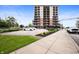 Modern multi-story condo with brick and siding, street parking, and manicured landscaping in a vibrant city setting at 435 Virginia Ave # 101, Indianapolis, IN 46203