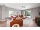 Comfortable living room with a plush leather sofa and a modern ceiling fan at 435 Virginia Ave # 101, Indianapolis, IN 46203